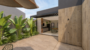Área externa de residência contemporânea com jardim tropical, revestimento amadeirado e integração com varanda e espaço de convivência.